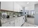 Efficient kitchen featuring bright white cabinetry, granite countertops, and modern appliances at 2001 S Ocean Blvd. # 815, Myrtle Beach, SC 29577