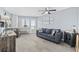 Cozy living room with a comfortable blue sofa and balcony access showcasing a great view at 2001 S Ocean Blvd. # 815, Myrtle Beach, SC 29577