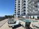 Enjoy sunbathing on the pool deck with ocean views and a modern condo building at 2001 S Ocean Blvd. # 815, Myrtle Beach, SC 29577