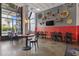 Restaurant with tables, chairs, and TV, offering a relaxing space for enjoying meals with interesting decor at 2001 S Ocean Blvd. # 815, Myrtle Beach, SC 29577