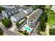 Overhead view of a condo complex with swimming pool, manicured greenery and parking spaces at 211 N Hillside Dr. # 204, North Myrtle Beach, SC 29582