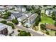 An aerial perspective of a condo complex, pool, and lush green surroundings on a sunny day at 211 N Hillside Dr. # 204, North Myrtle Beach, SC 29582
