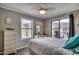 Inviting bedroom with a private balcony, bright natural light, and a ceiling fan at 211 N Hillside Dr. # 204, North Myrtle Beach, SC 29582