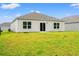 A well-maintained lawn is located behind this home, which also features white siding and multiple windows at 211 Pine Forest Dr., Conway, SC 29526
