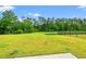 A spacious, well-kept backyard offers lots of room for outdoor activities and a serene view at 211 Pine Forest Dr., Conway, SC 29526