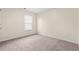 This simple bedroom has neutral walls, carpet, and a window that allows in ample natural light at 211 Pine Forest Dr., Conway, SC 29526