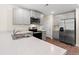 This kitchen features stainless steel appliances, light countertops, and light grey cabinets at 211 Pine Forest Dr., Conway, SC 29526