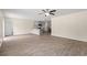 Open-concept living room displays wood floors, ceiling fan, and views into the kitchen at 211 Pine Forest Dr., Conway, SC 29526