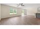 This living room boasts hardwood floors, a ceiling fan, and a sliding glass door at 211 Pine Forest Dr., Conway, SC 29526