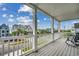 A beautiful balcony with white railings offering a view of the neighborhood at 211B 15Th Ave. S, Surfside Beach, SC 29575