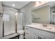 The bright bathroom features a glass-enclosed shower and a white vanity with a sink at 211B 15Th Ave. S, Surfside Beach, SC 29575