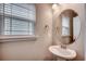 Powder room featuring a pedestal sink and modern finishes at 211B 15Th Ave. S, Surfside Beach, SC 29575