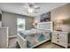 The primary bedroom has a ceiling fan, wood-look floors, and a bed with matching nightstands at 211B 15Th Ave. S, Surfside Beach, SC 29575