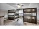 Spacious bedroom featuring two bunkbeds, a ceiling fan, and a window letting in natural light at 211B 15Th Ave. S, Surfside Beach, SC 29575