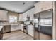 Beautiful kitchen features white cabinets and stainless steel appliances at 211B 15Th Ave. S, Surfside Beach, SC 29575
