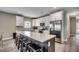 Kitchen with white cabinets, stainless steel appliances, large island and bar stool seating at 211B 15Th Ave. S, Surfside Beach, SC 29575