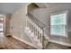 Carpeted staircase with white banister offers access to the upper level of the home at 211B 15Th Ave. S, Surfside Beach, SC 29575