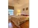 Bedroom with a window, a queen-sized bed, and a bedside table with lamp at 216 Walden Lake Rd., Conway, SC 29526