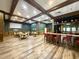 A spacious community room featuring a bar, tables, and a projector screen, perfect for social gatherings at 216 Walden Lake Rd., Conway, SC 29526
