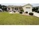 Lovely home with red shutters, a well kept lawn, landscaped garden, and a charming front porch at 216 Walden Lake Rd., Conway, SC 29526