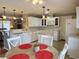 Spacious kitchen with white cabinets, granite countertops and an island for extra counter space and seating at 216 Walden Lake Rd., Conway, SC 29526