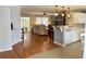 Open floor plan with the living room flowing into the kitchen with hardwood floors and neutral wall colors at 216 Walden Lake Rd., Conway, SC 29526