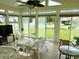 Sunroom with lots of windows and white wicker furniture at 216 Walden Lake Rd., Conway, SC 29526