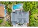 Aerial view of the property showing the home, pool, and surrounding landscape at 24 Jerry Ct., Pawleys Island, SC 29585