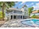 Beautiful backyard with large pool, spacious patio, and multilevel decks perfect for entertaining at 24 Jerry Ct., Pawleys Island, SC 29585