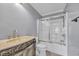 Elegant bathroom featuring an ornately carved vanity and a tub with sliding glass doors at 24 Jerry Ct., Pawleys Island, SC 29585
