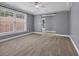 Spacious bedroom with plush carpeting, large windows, and tray ceilings for a luxurious feel at 24 Jerry Ct., Pawleys Island, SC 29585