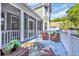 Relaxing outdoor deck with seating area and views of the lush backyard at 24 Jerry Ct., Pawleys Island, SC 29585