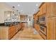 Kitchen featuring stainless appliances, hardwood floors, and wooden cabinetry at 24 Jerry Ct., Pawleys Island, SC 29585
