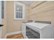 Functional laundry room with modern appliances and ample shelving for storage at 24 Jerry Ct., Pawleys Island, SC 29585