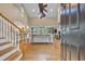 Open concept living room featuring hardwood floors, high ceilings, and staircase with a large ceiling fan at 24 Jerry Ct., Pawleys Island, SC 29585