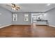 Open-concept living room features hardwood floors, a ceiling fan, and easy access to the kitchen at 24 Jerry Ct., Pawleys Island, SC 29585