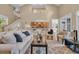 Cozy living room with neutral decor, hardwood floors, staircase, and views to the kitchen at 24 Jerry Ct., Pawleys Island, SC 29585