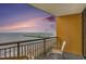A condo balcony overlooks the beach with seating and a table to enjoy the gorgeous views at 2600 N Ocean Blvd. # 1406, Myrtle Beach, SC 29577