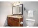 Bathroom featuring a sink, toilet, and mirror at 2600 N Ocean Blvd. # 1406, Myrtle Beach, SC 29577