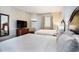 Bedroom features two beds, neutral walls, and a television at 2600 N Ocean Blvd. # 1406, Myrtle Beach, SC 29577