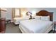 Bedroom featuring two beds with wooden headboards and neutral walls at 2600 N Ocean Blvd. # 1406, Myrtle Beach, SC 29577