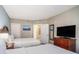 Bedroom featuring two beds, closet, dresser, and neutral walls at 2600 N Ocean Blvd. # 1406, Myrtle Beach, SC 29577