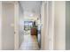 Hallway view into condo kitchen and living area with tile floor, and balcony ocean view at 2600 N Ocean Blvd. # 1406, Myrtle Beach, SC 29577