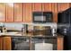 Kitchen with granite countertops, tile backsplash and black appliances at 2600 N Ocean Blvd. # 1406, Myrtle Beach, SC 29577