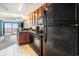 Open kitchen with appliances and tiled floor leads to living area with ocean view at 2600 N Ocean Blvd. # 1406, Myrtle Beach, SC 29577