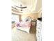 Comfortable bedroom featuring a tray ceiling, ceiling fan and a white decorative bed frame at 2707 Canvasback Trail, Myrtle Beach, SC 29588