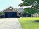 Charming single-story brick home with a well-kept lawn and attached garage at 2707 Canvasback Trail, Myrtle Beach, SC 29588