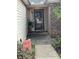 A cozy front porch features a decorative storm door, brick accents and a potted plant at 2707 Canvasback Trail, Myrtle Beach, SC 29588