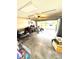 Spacious garage filled with tools and equipment with the garage door open to the driveway at 2707 Canvasback Trail, Myrtle Beach, SC 29588