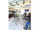A large garage with a refrigerator, tools, and garage equipment at 2707 Canvasback Trail, Myrtle Beach, SC 29588